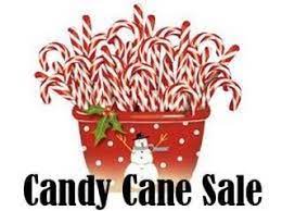 Image of a red bucket full of red and white candy canes.  The bucket has a snowman, red dots and a holly sprig on the front.  The text says Candy Cane Sale.