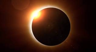 Picture of a solar eclipse.  The moon in front of the sun.