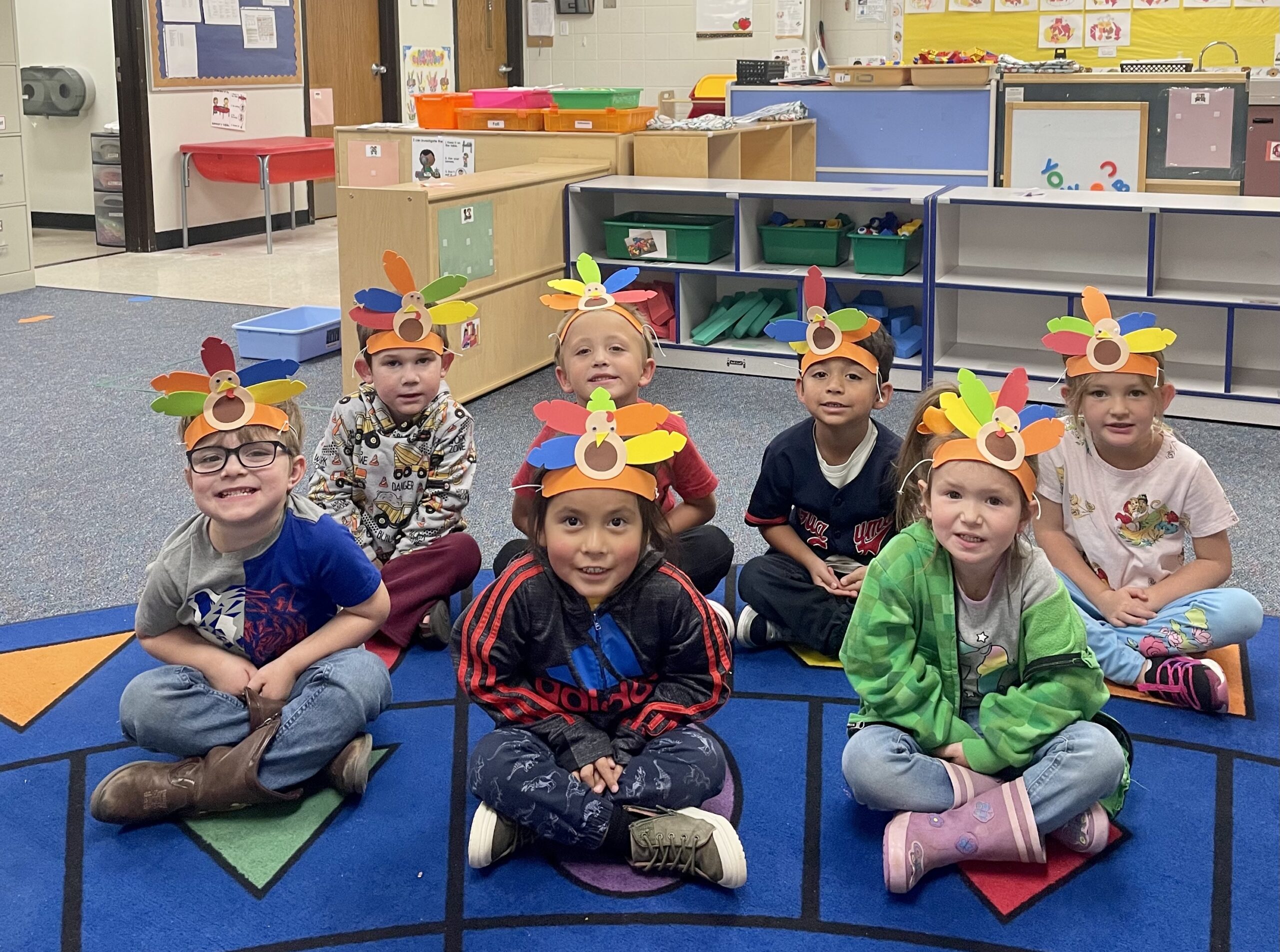 Photograph of preschoolers with Thanksgiving hats.